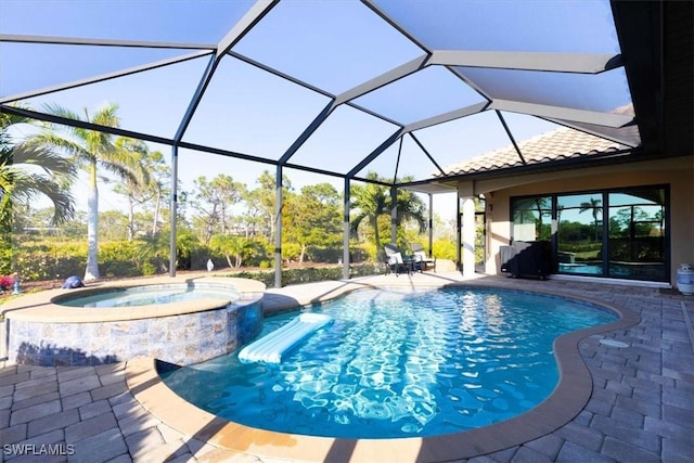 view of pool with glass enclosure, an in ground hot tub, and a patio