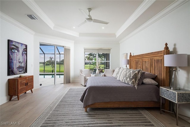 bedroom with access to exterior, light hardwood / wood-style floors, ceiling fan, and crown molding