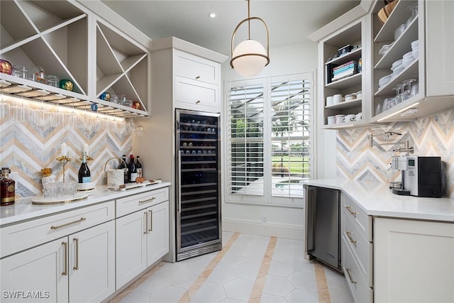 wine area with light tile patterned floors and beverage cooler