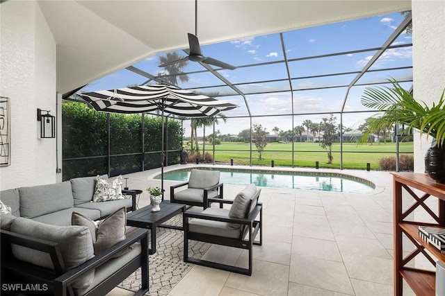 view of pool featuring outdoor lounge area, a patio area, and glass enclosure