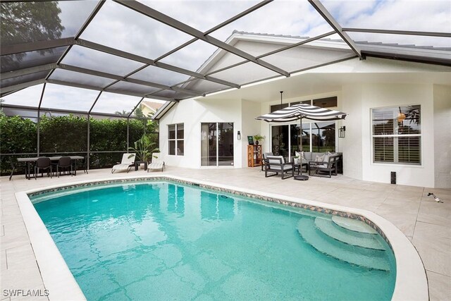 view of pool featuring a patio, a lanai, and outdoor lounge area