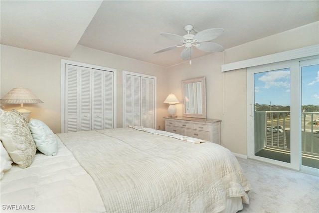 bedroom featuring two closets, access to outside, ceiling fan, and carpet flooring