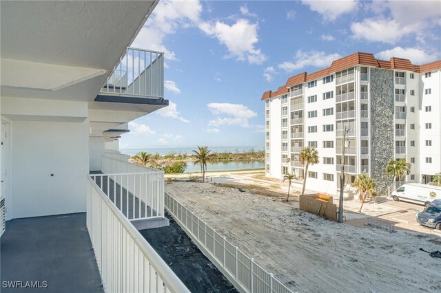 balcony featuring a water view