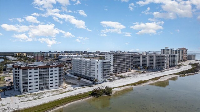 bird's eye view with a beach view and a water view