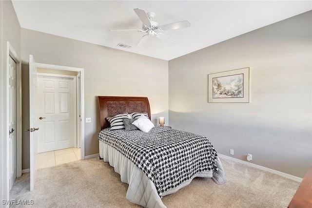 bedroom featuring light carpet and ceiling fan