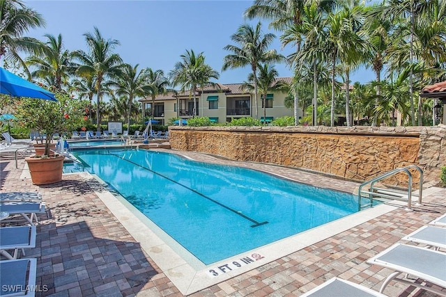 view of pool featuring a patio