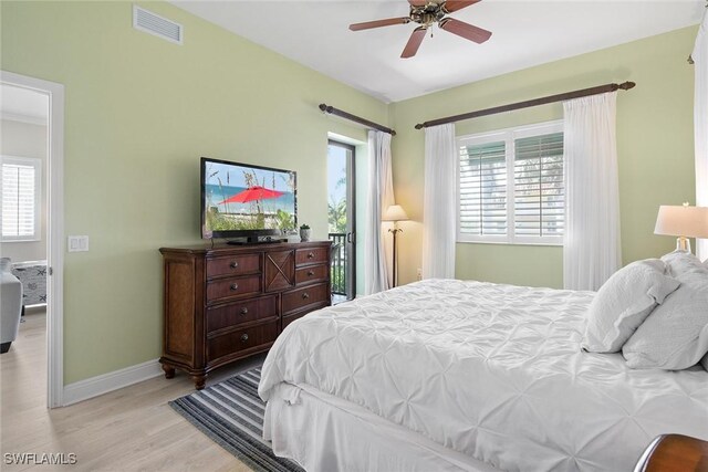 bedroom with light hardwood / wood-style floors and ceiling fan