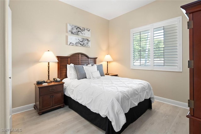 bedroom with light wood-type flooring