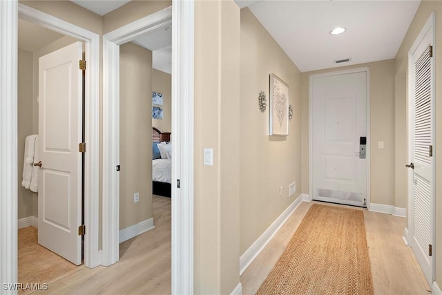 corridor featuring light hardwood / wood-style flooring