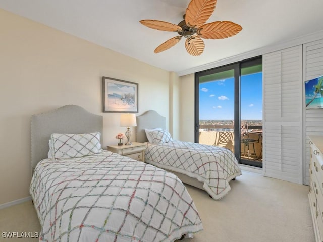 carpeted bedroom featuring access to outside and ceiling fan