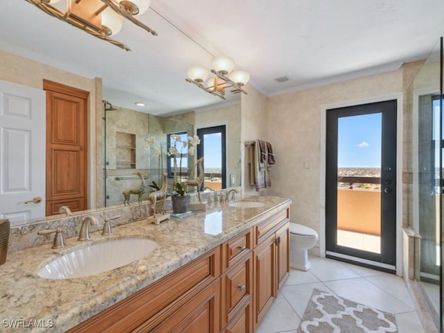 bathroom with tile patterned flooring, vanity, a shower with door, and plenty of natural light