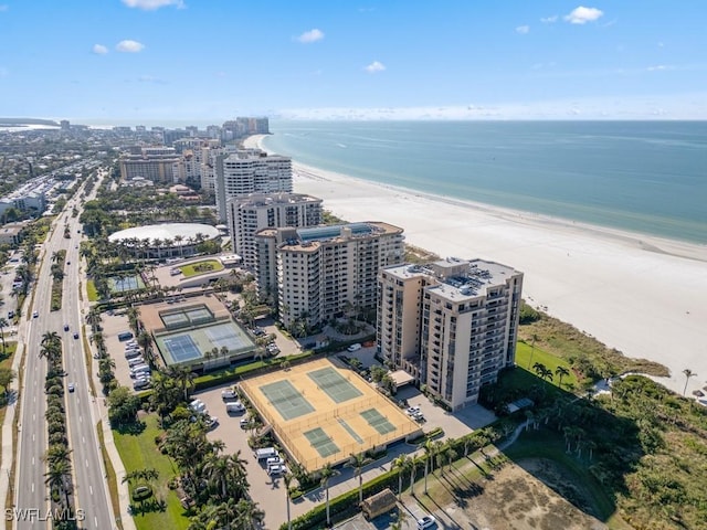 bird's eye view featuring a view of the beach and a water view