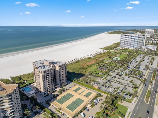 bird's eye view featuring a water view and a view of the beach