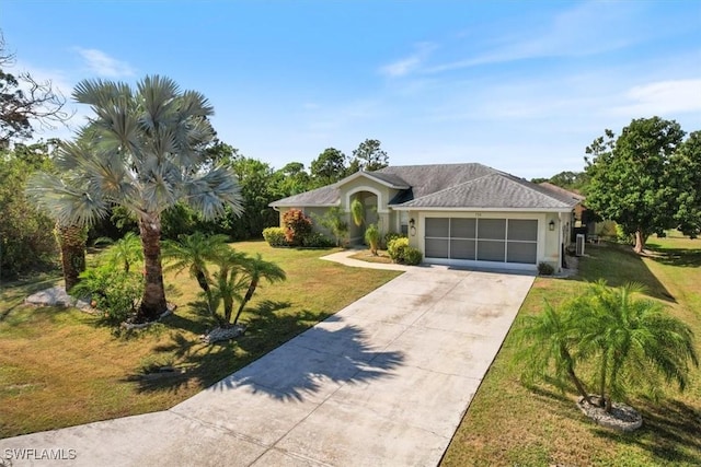 ranch-style home with a front yard and a garage