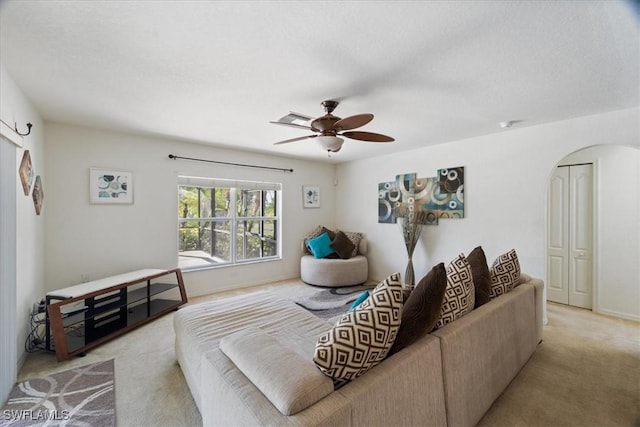 living room featuring ceiling fan and light carpet