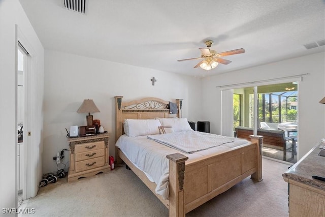 bedroom with access to exterior, light colored carpet, and ceiling fan