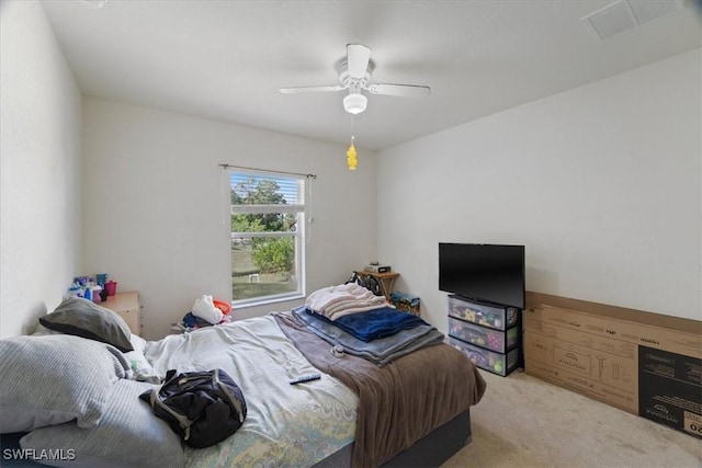 bedroom featuring ceiling fan and light carpet