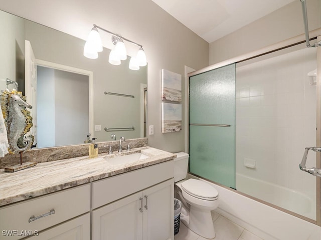 full bathroom featuring tile patterned flooring, vanity, bath / shower combo with glass door, and toilet