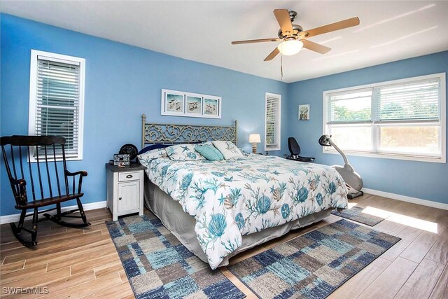 bedroom featuring light hardwood / wood-style flooring and ceiling fan