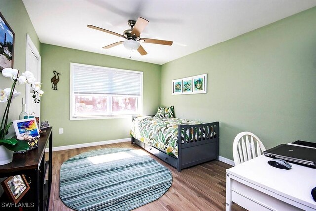 bedroom featuring wood-type flooring and ceiling fan