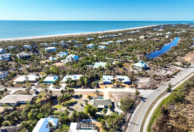 bird's eye view featuring a beach view and a water view