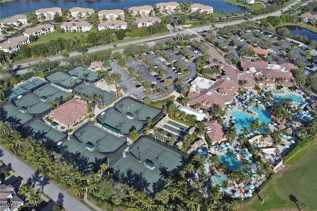 birds eye view of property with a water view