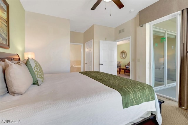 bedroom featuring carpet floors, ensuite bathroom, and ceiling fan