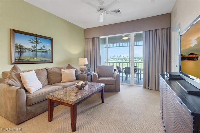 living room featuring light carpet and ceiling fan