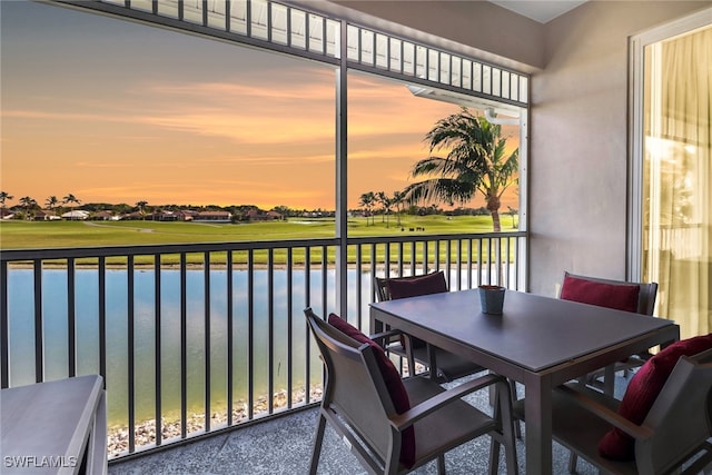 balcony at dusk with a water view