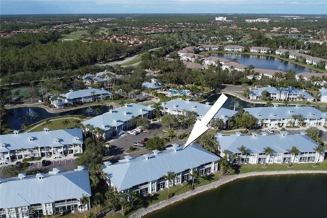 birds eye view of property featuring a water view