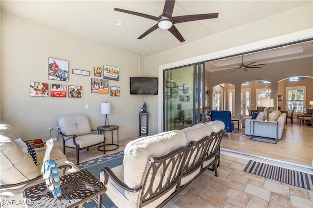 living room with hardwood / wood-style floors and ceiling fan