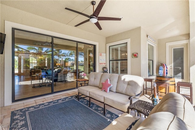 living room with hardwood / wood-style flooring and ceiling fan