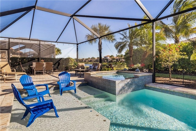 view of swimming pool with an in ground hot tub, a patio, and a lanai