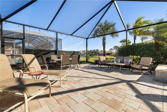 view of patio / terrace featuring a lanai