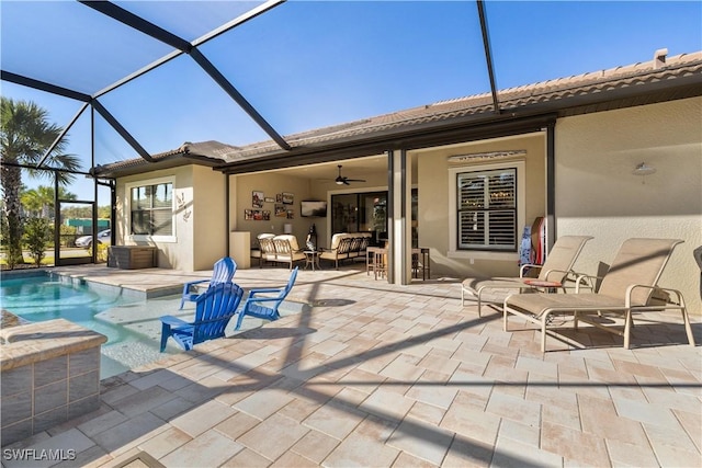 back of house featuring a lanai, a patio area, and ceiling fan