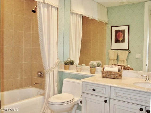 full bathroom featuring vanity, shower / bath combination with curtain, and toilet