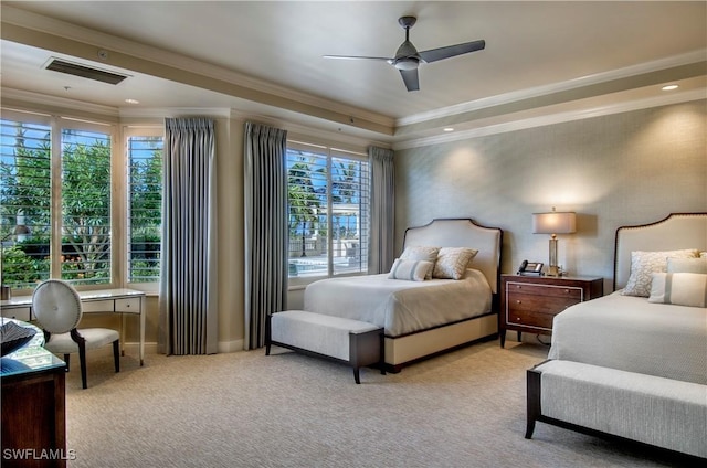 carpeted bedroom featuring multiple windows, crown molding, and ceiling fan