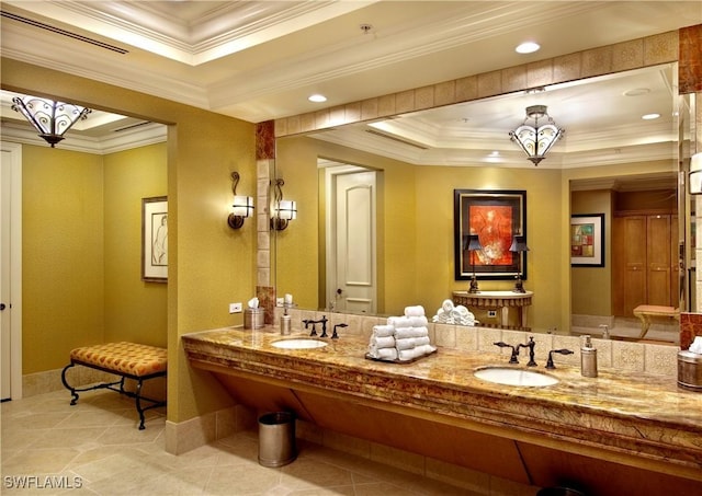 bathroom featuring a tray ceiling, crown molding, and tile patterned floors