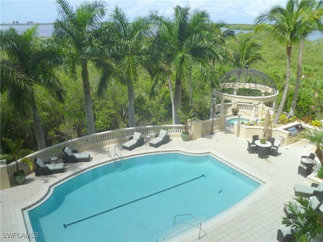 view of swimming pool featuring a patio