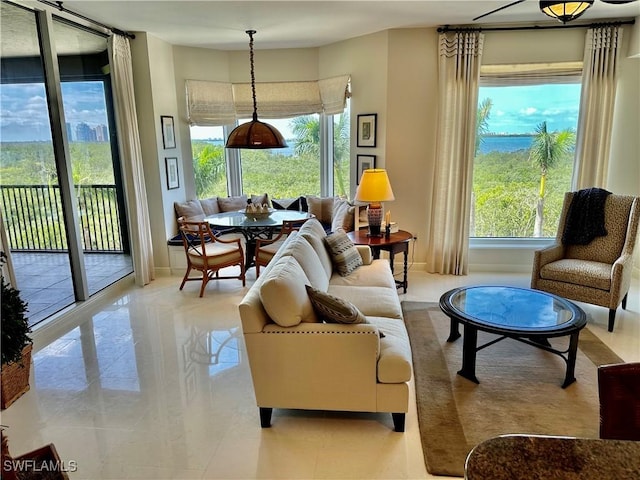 living area with light tile patterned floors and plenty of natural light