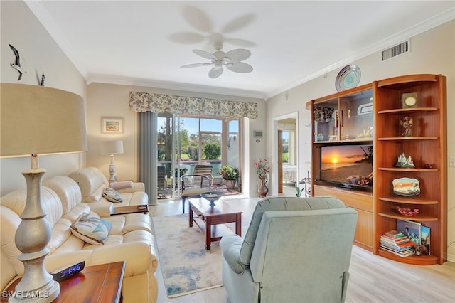 living room featuring ceiling fan, light hardwood / wood-style floors, and ornamental molding