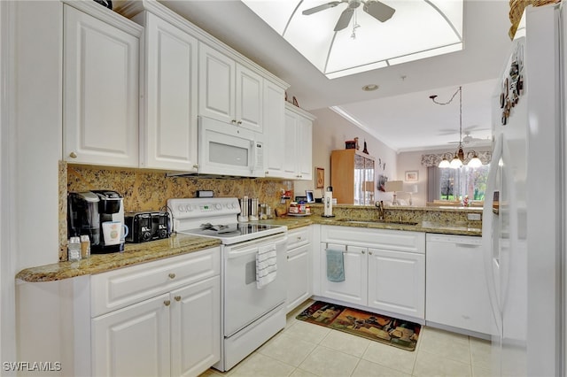 kitchen featuring white appliances, white cabinets, ceiling fan with notable chandelier, sink, and light tile patterned flooring