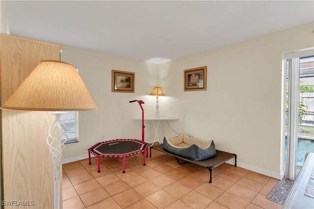 living area featuring light tile patterned floors