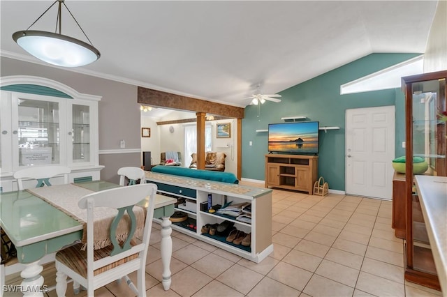 dining area with ceiling fan, plenty of natural light, light tile patterned flooring, and vaulted ceiling