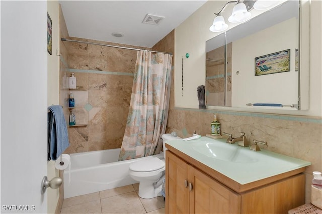 full bathroom with shower / tub combo, vanity, tile walls, tile patterned flooring, and toilet