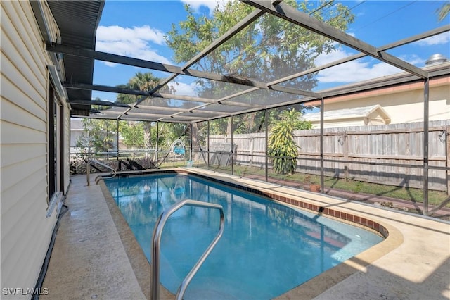 view of pool with a lanai