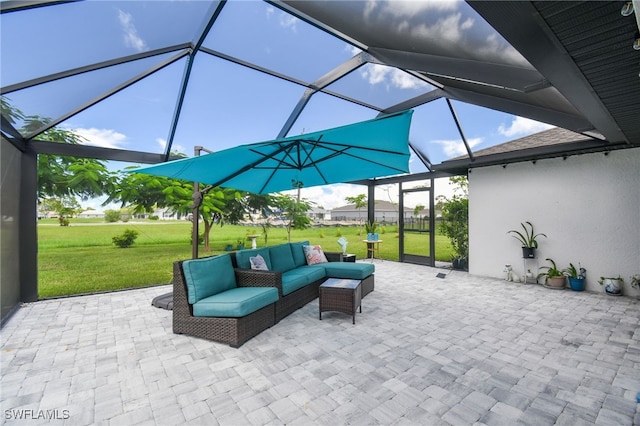 view of patio with an outdoor hangout area and glass enclosure