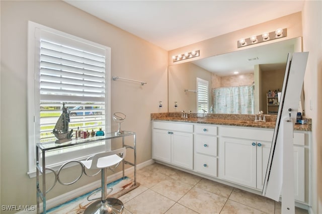 bathroom featuring tile patterned floors, vanity, and a shower with shower curtain