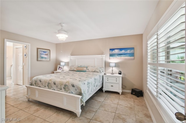 tiled bedroom with ceiling fan