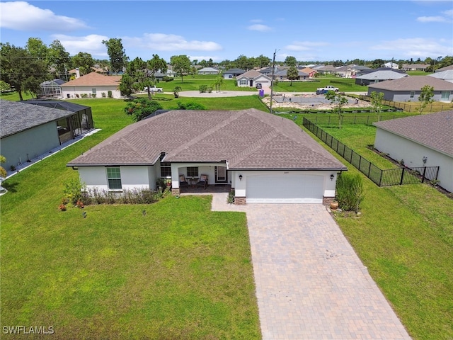 view of front facade with a front yard and a garage